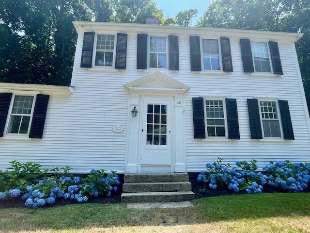 118 Main Street Sandwich, MA 02563 - Photo 2 of 41 a front view of a house with a garden