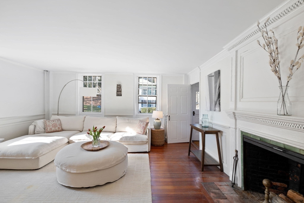 118 Main Street Sandwich, MA 02563 - Photo 21 of 41 a living room with furniture and a fireplace