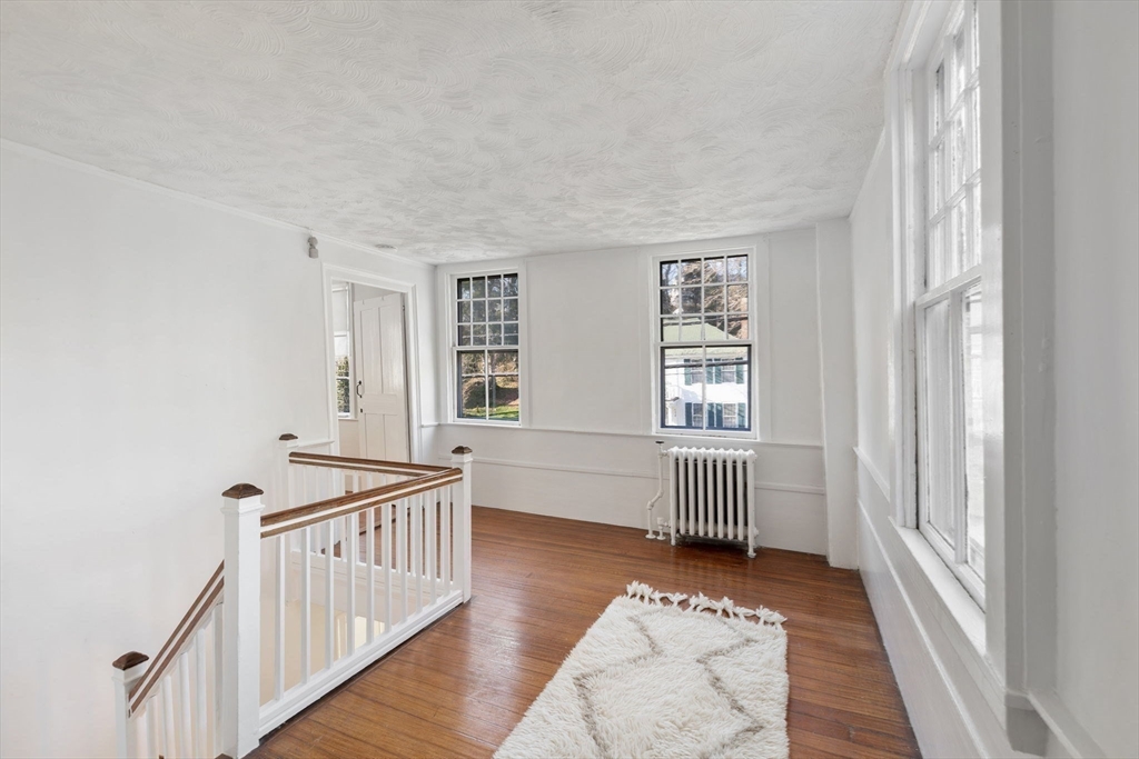 118 Main Street Sandwich, MA 02563 - Photo 23 of 41 a bedroom with furniture and wooden floor