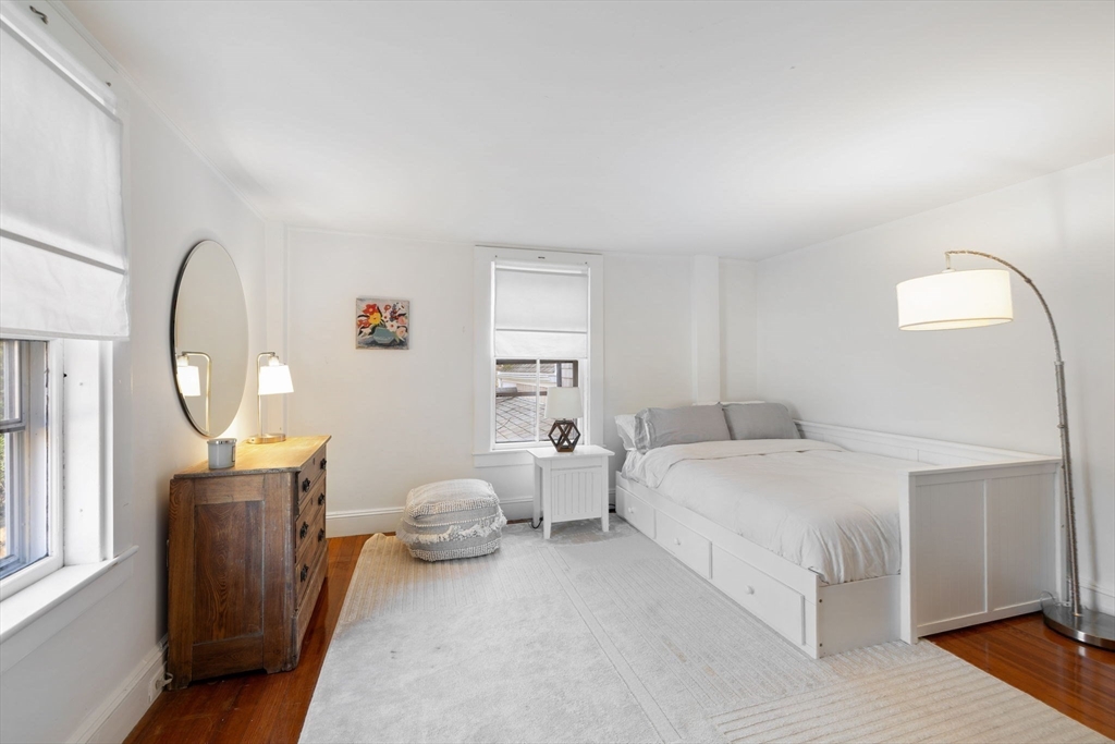 118 Main Street Sandwich, MA 02563 - Photo 29 of 41 a bedroom with bed and a large window