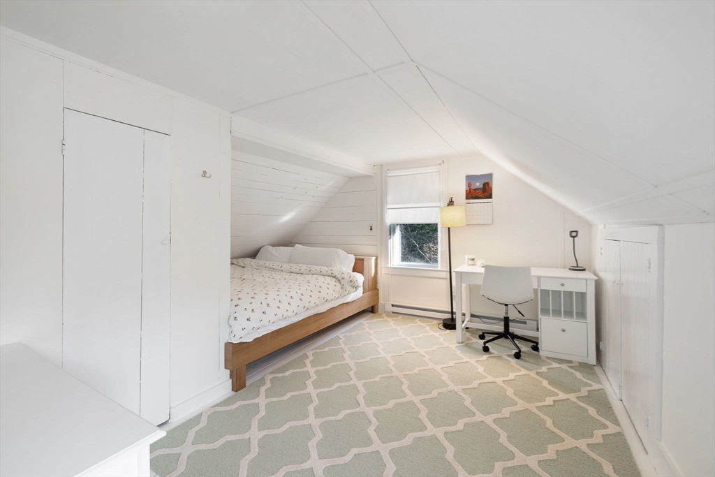 118 Main Street Sandwich, MA 02563 - Photo 30 of 41 a bedroom with a bed and a mirror