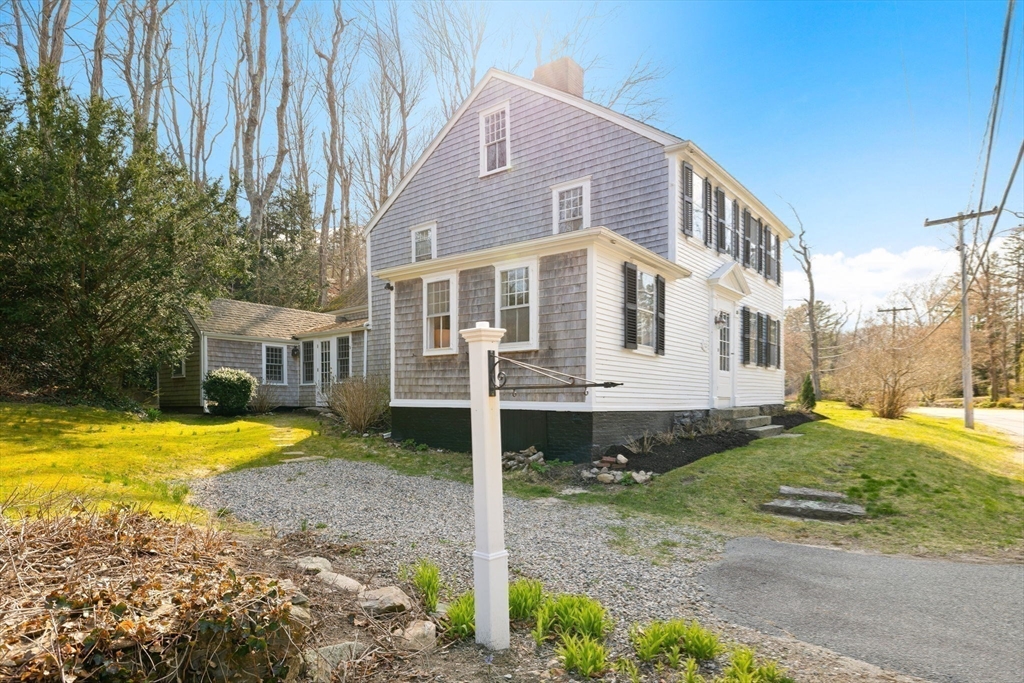 118 Main Street Sandwich, MA 02563 - Photo 33 of 41 a front view of a house with a yard