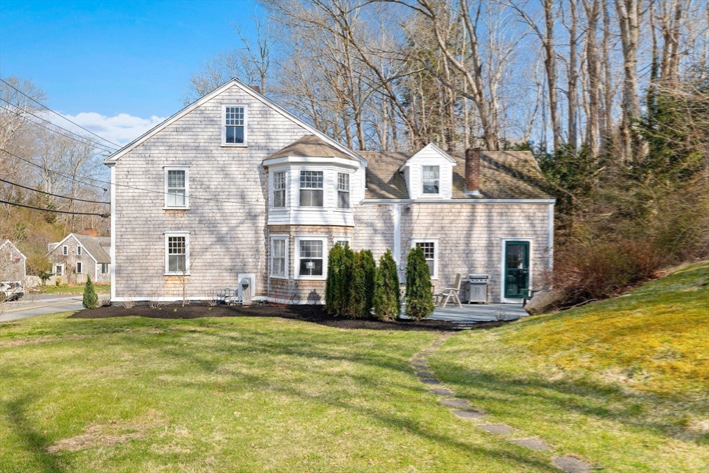 118 Main Street Sandwich, MA 02563 - Photo 35 of 41 a front view of a house with a yard
