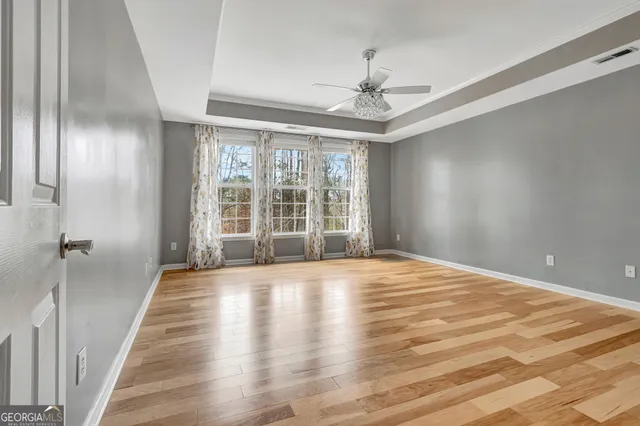 a view of a kitchen with a sink and refrigerator