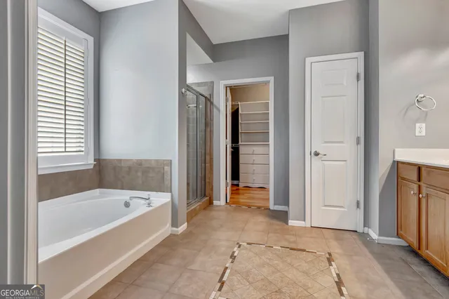 a view of an empty room with a fireplace