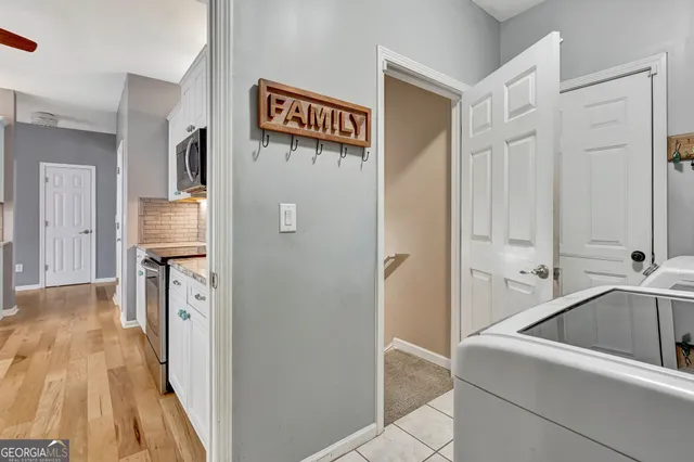 a en suite bathroom with a granite countertop sink and a mirror