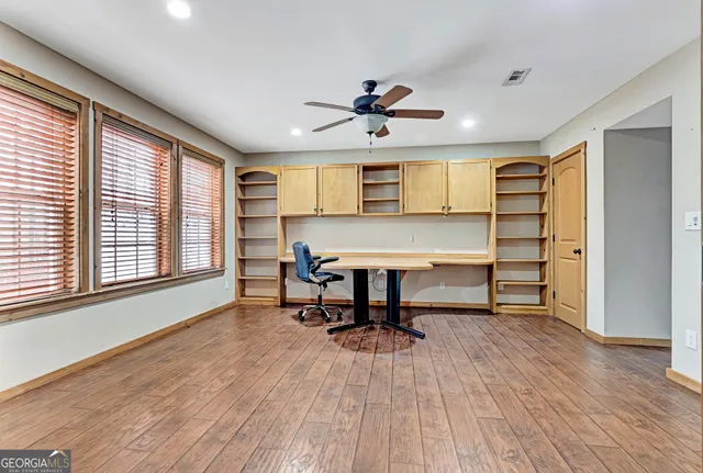 a view of a balcony with wooden floor