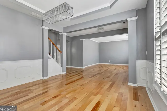 a view of kitchen with stainless steel appliances granite countertop stove top oven and refrigerator