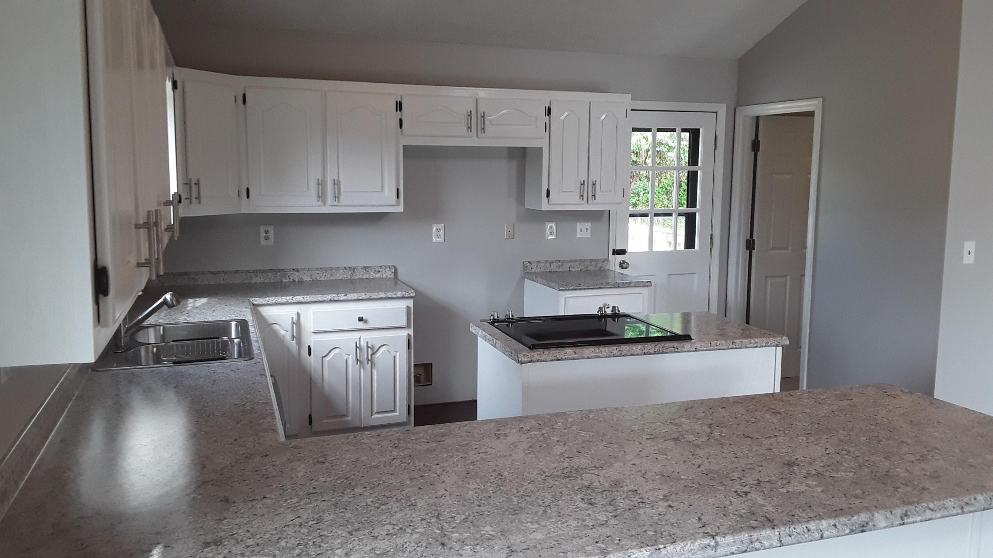 129 Rosedale Avenue Rutledge, TN 37861 - Photo 11 of 34 a kitchen with stainless steel appliances granite countertop a stove a sink and a refrigerator
