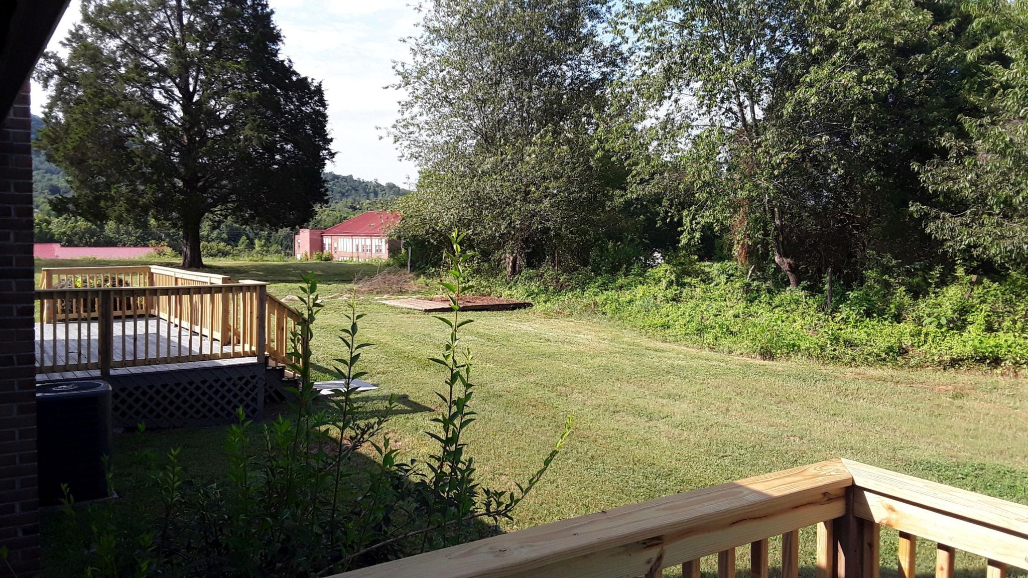 129 Rosedale Avenue Rutledge, TN 37861 - Photo 26 of 34 a view of a garden and floor to ceiling window and wooden fence