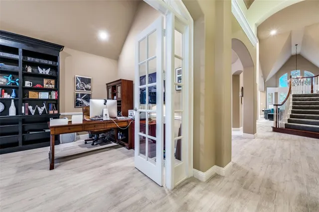 a view of a workspace with furniture and staircase