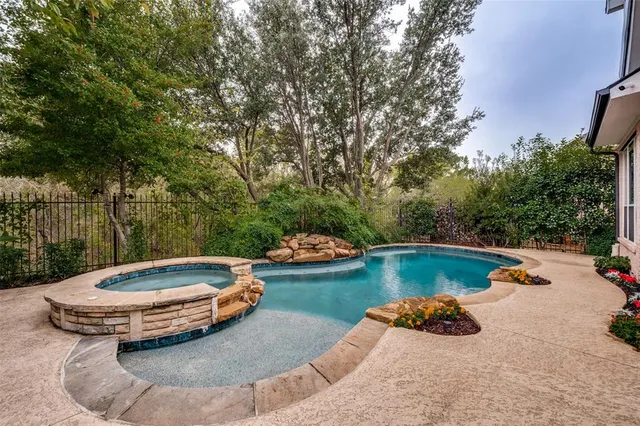 a view of swimming pool having outdoor seating