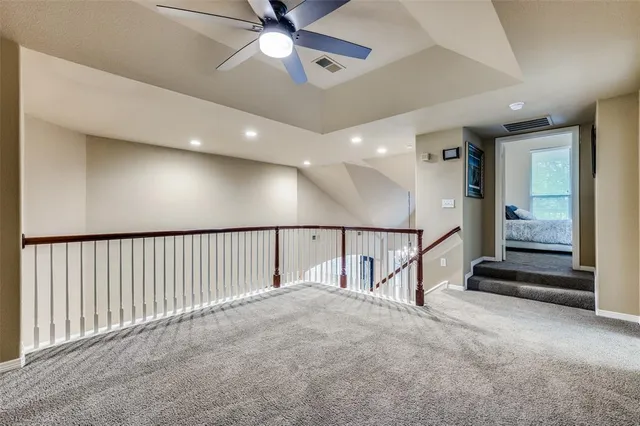 en view interior of a house with stairs and a ceiling fan