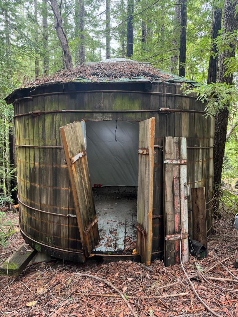320 Timber Cove Boulder Creek, CA 95006 - Photo 6 of 17 a view of a wooden house with a wooden fence