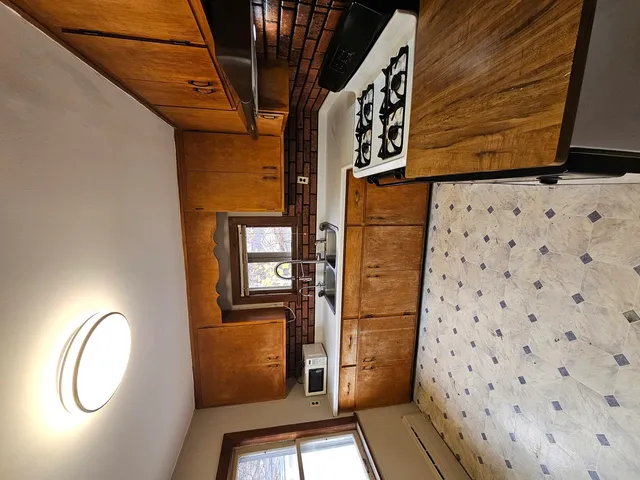 a view of a hallway with windows