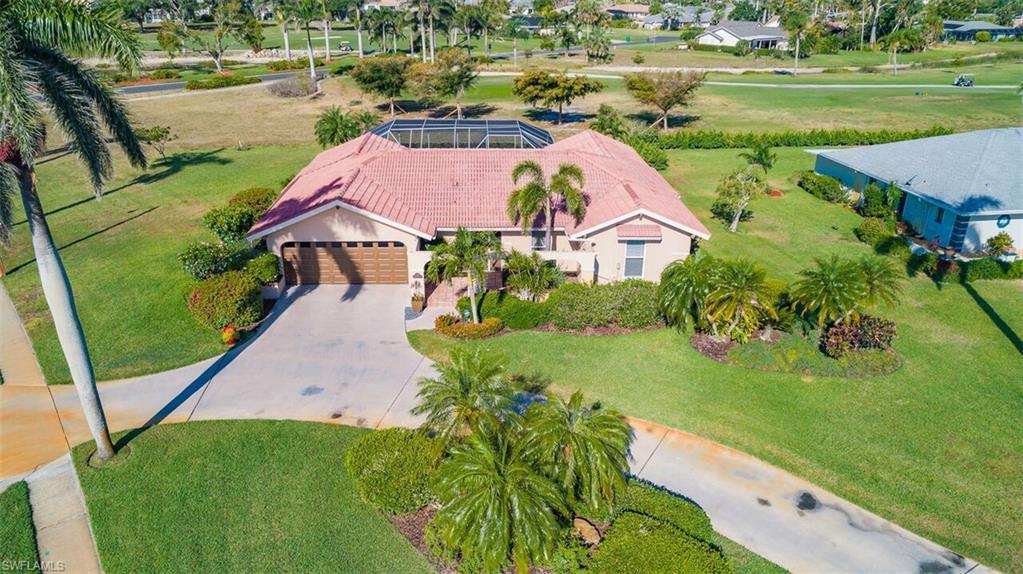 478 Torrey Pines Point Naples, FL 34113 - Photo 12 of 16 an aerial view of a house with a yard basket ball court and outdoor seating