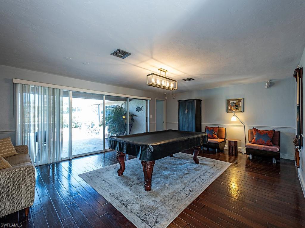 478 Torrey Pines Point Naples, FL 34113 - Photo 6 of 16 a living room with furniture and a wooden floor