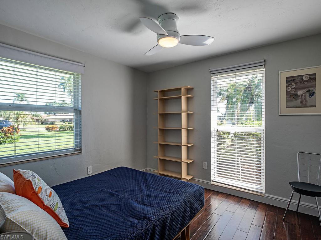 478 Torrey Pines Point Naples, FL 34113 - Photo 10 of 16 a bedroom with a bed and a window