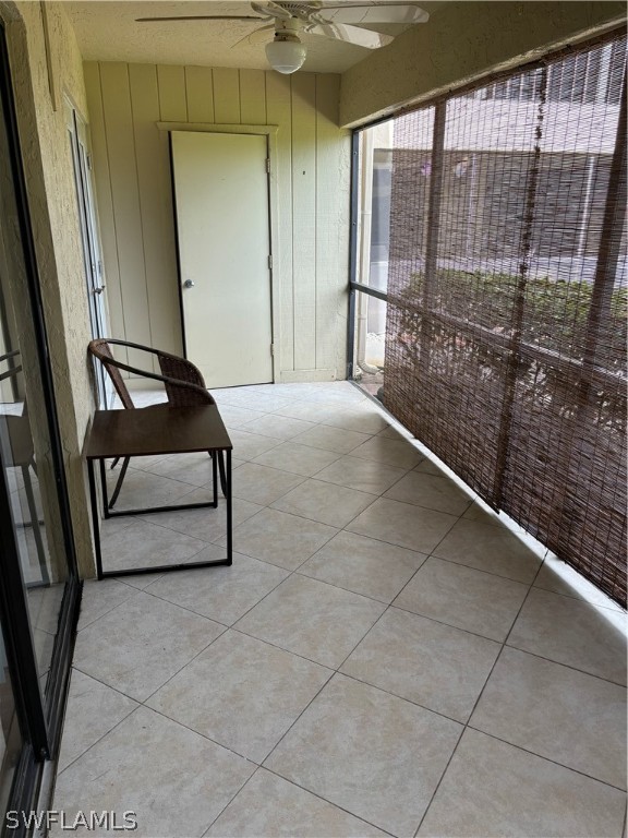 5501 Rattlesnake Hammock Road, Unit 107 Naples, FL 34113 - Photo 4 of 23 a view of a room with sliding door