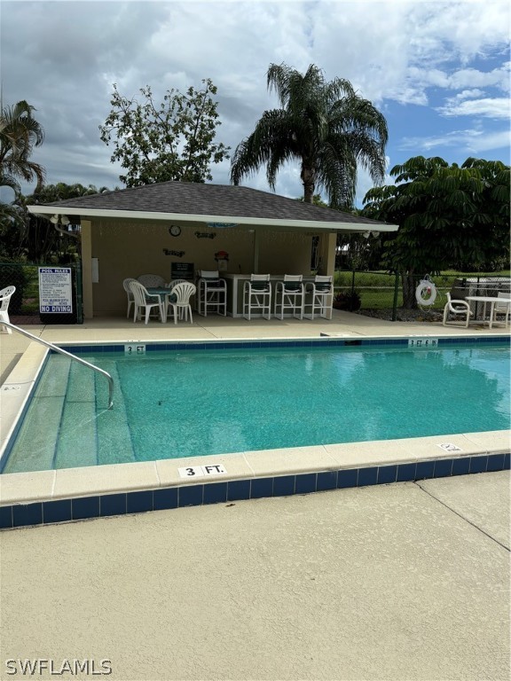 5501 Rattlesnake Hammock Road, Unit 107 Naples, FL 34113 - Photo 8 of 23 a view of swimming pool from a balcony