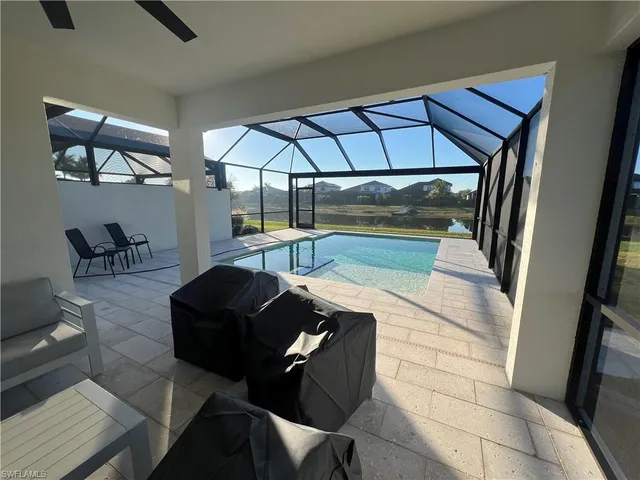a view of an outdoor space pool patio and yard in back