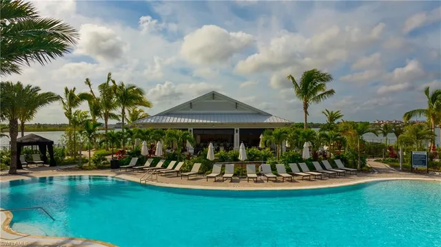 a view of swimming pool from a lake view