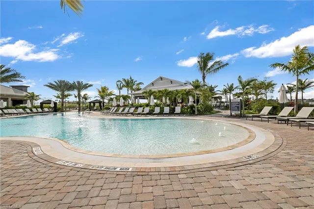 a view of a swimming pool with a sitting area