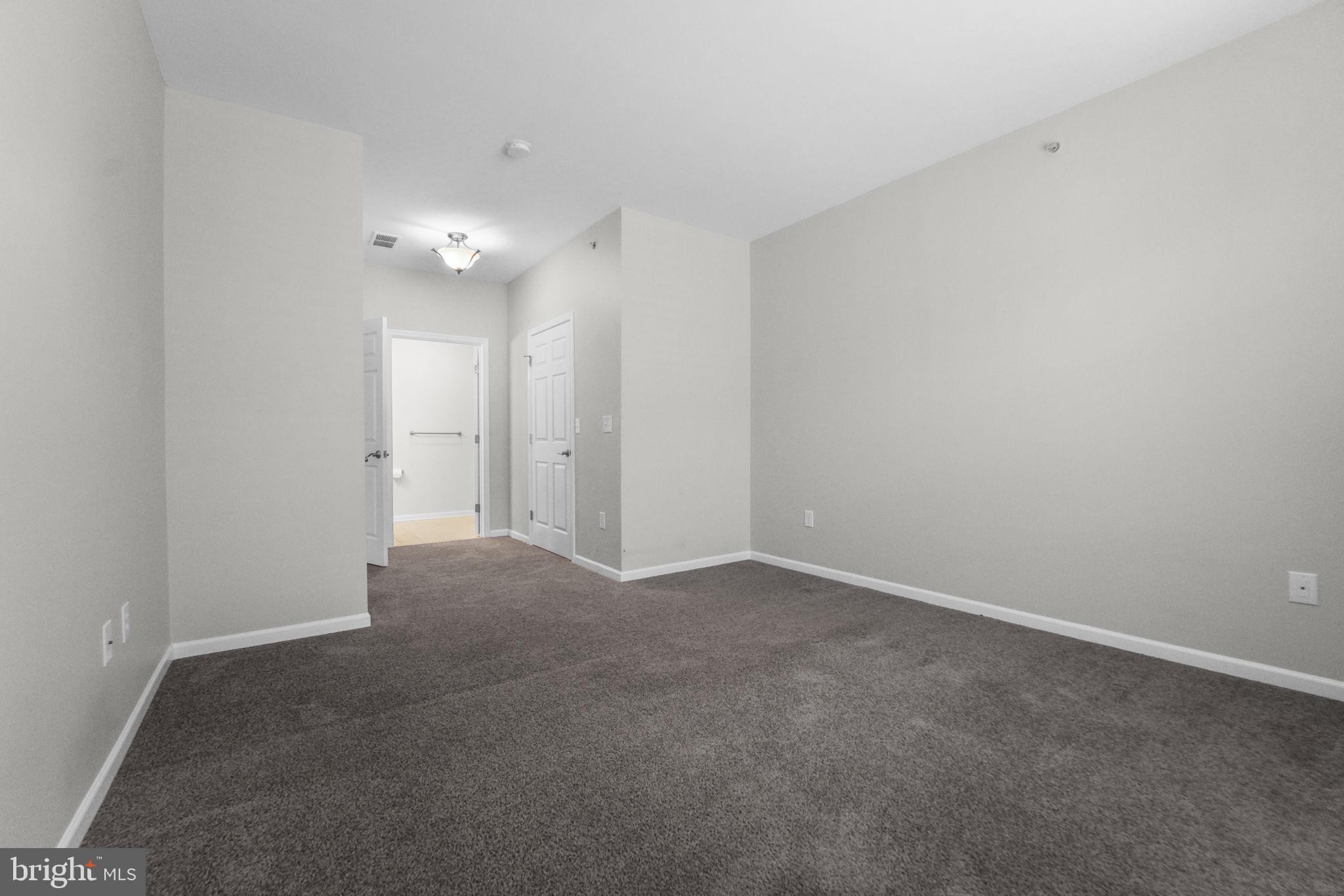 59 Kyle Way Ewing, NJ 08628 - Photo 14 of 35 a view of an empty room with a ceiling fan