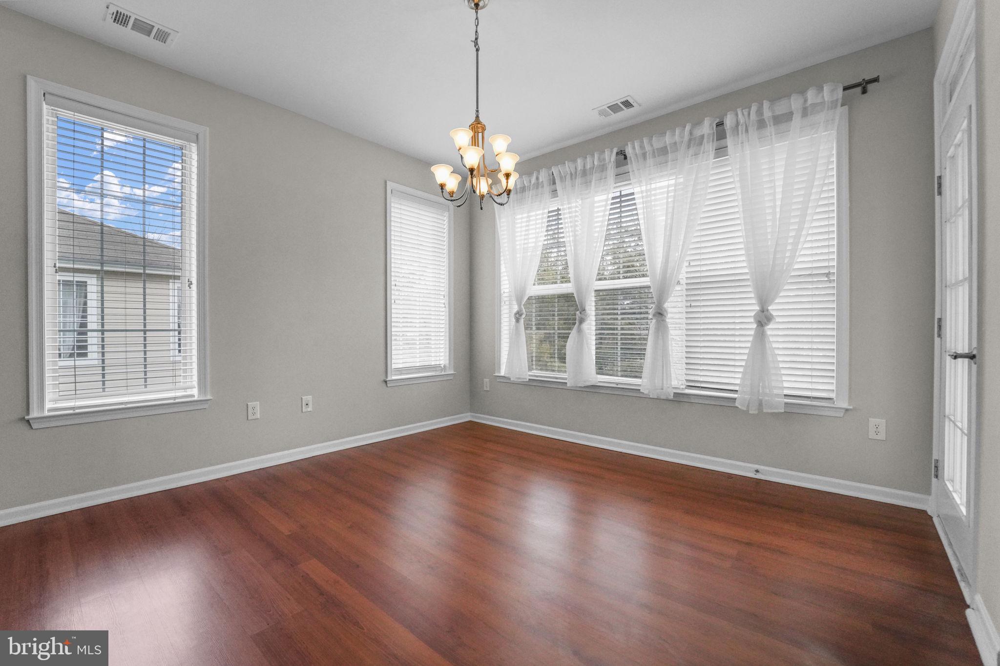 59 Kyle Way Ewing, NJ 08628 - Photo 18 of 35 a view of an empty room with wooden floor and a window