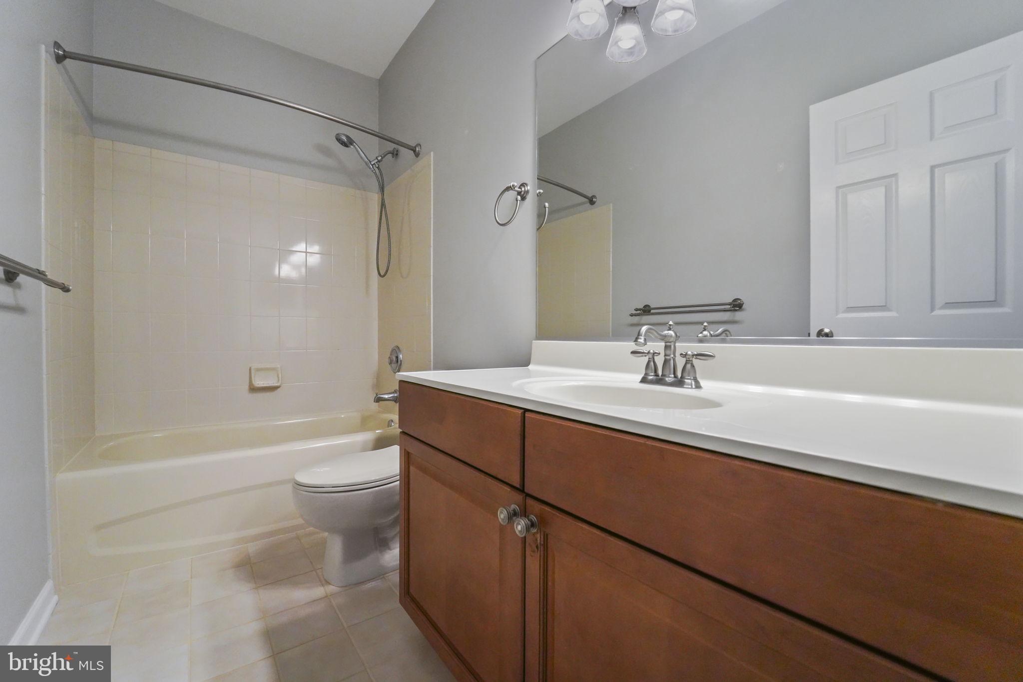 59 Kyle Way Ewing, NJ 08628 - Photo 2 of 35 a bathroom with a sink a toilet and shower