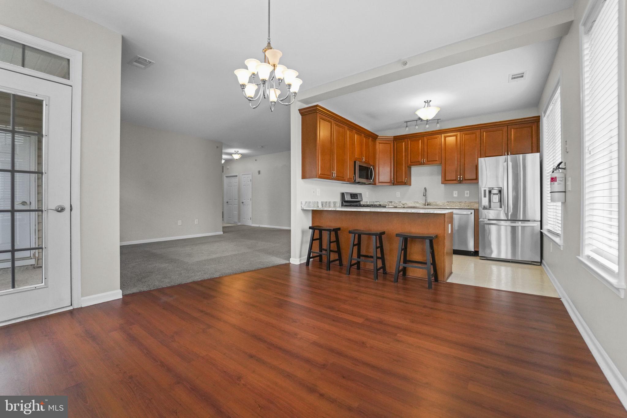 59 Kyle Way Ewing, NJ 08628 - Photo 21 of 35 a view of a dining room with furniture window and wooden floor