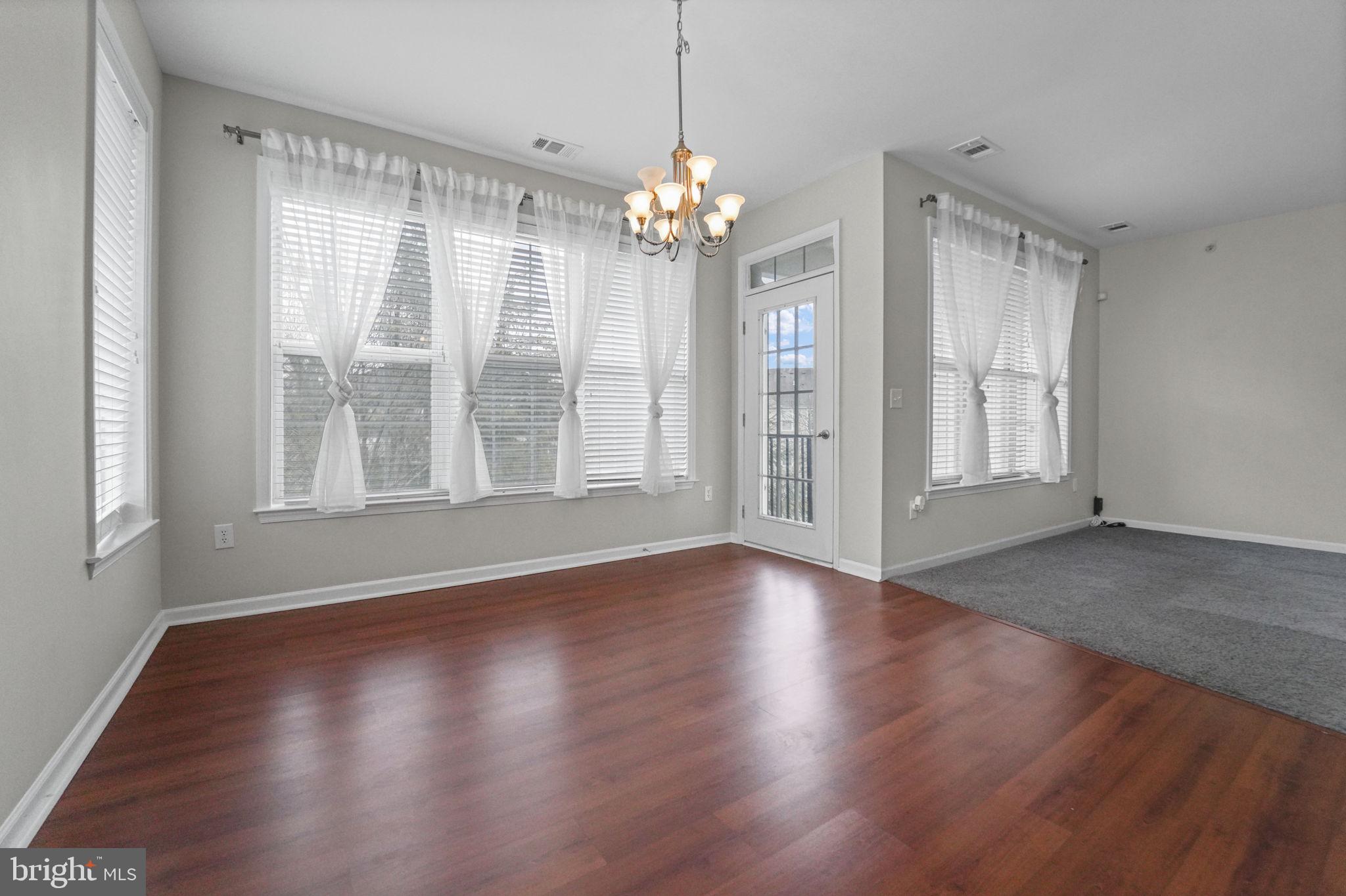 59 Kyle Way Ewing, NJ 08628 - Photo 22 of 35 a view of an empty room with wooden floor and a window