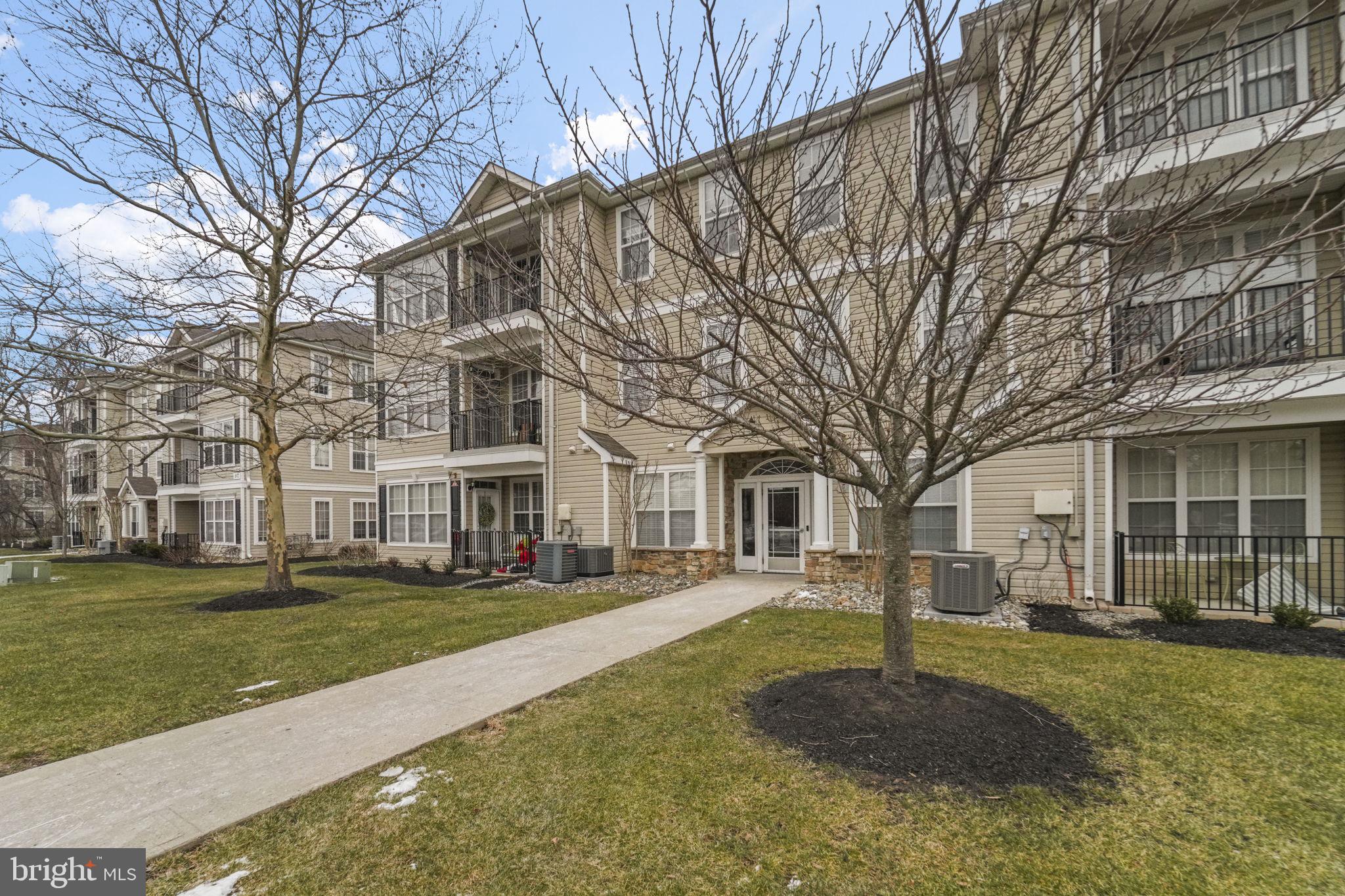 59 Kyle Way Ewing, NJ 08628 - Photo 31 of 35 a front view of a house with a yard