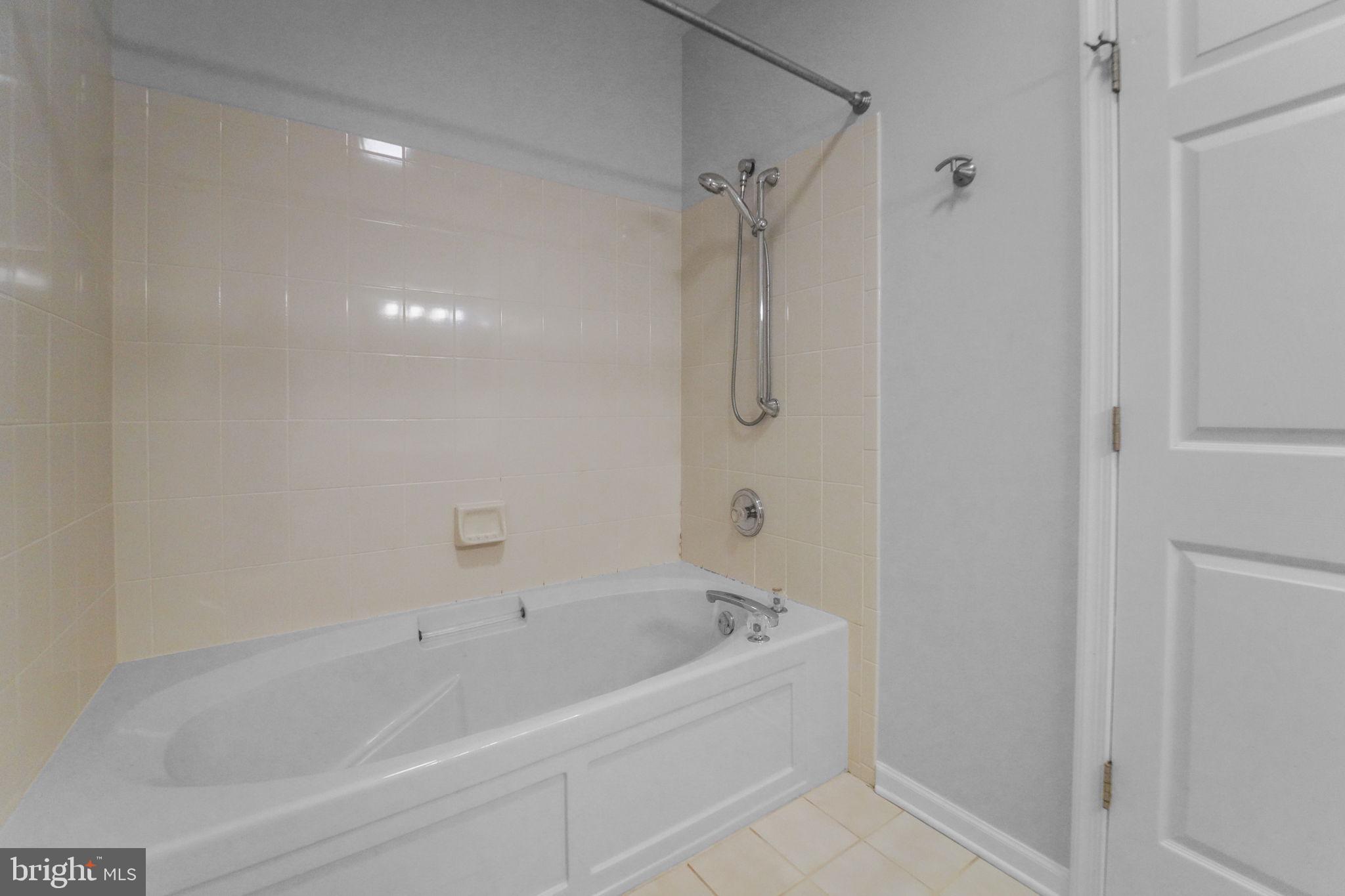 59 Kyle Way Ewing, NJ 08628 - Photo 4 of 35 a white bath tub sitting next to a shower