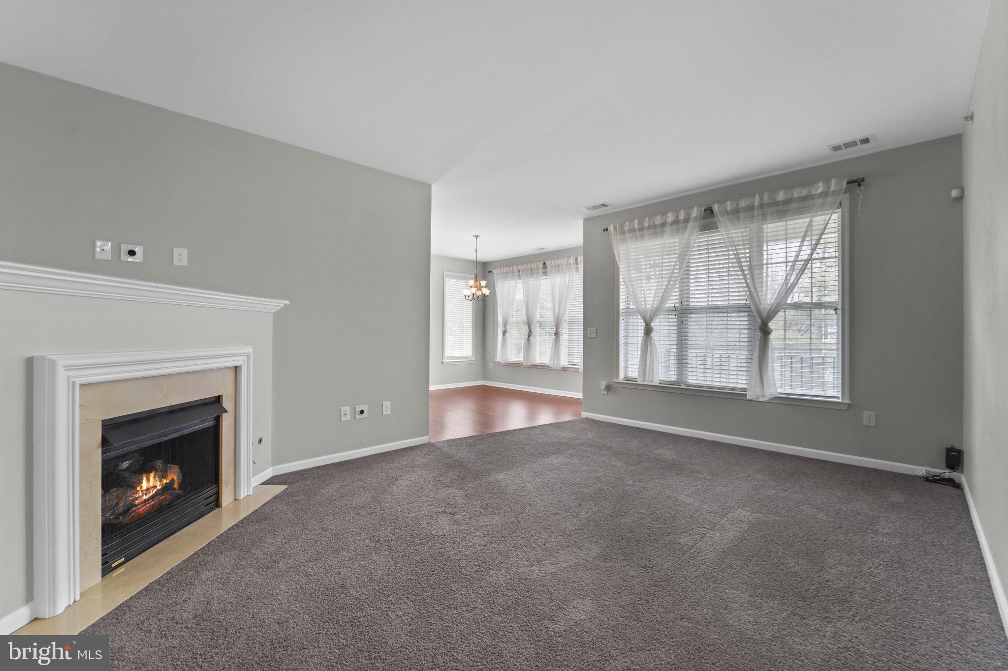 59 Kyle Way Ewing, NJ 08628 - Photo 9 of 35 a view of an empty room with a fireplace