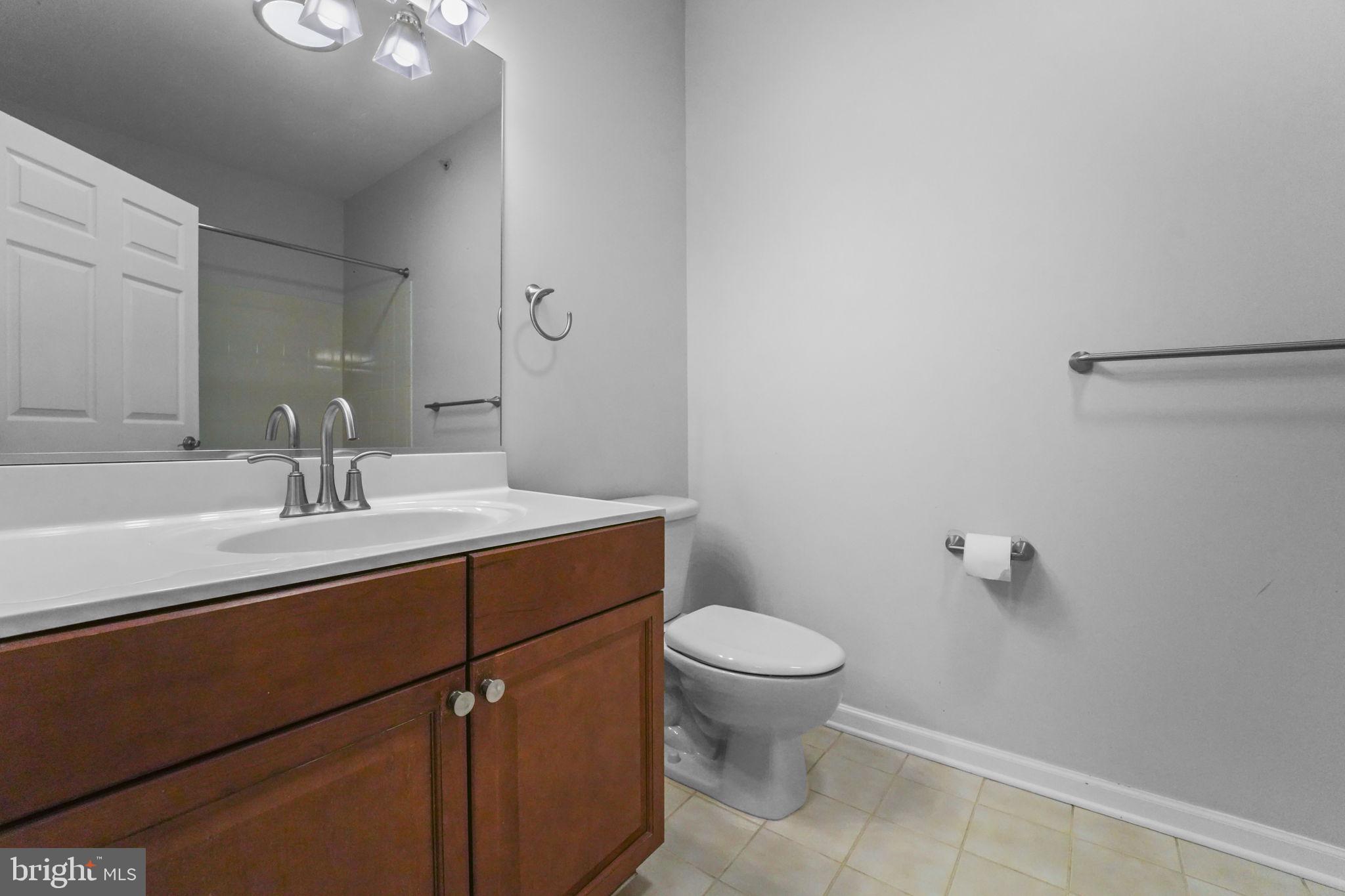 59 Kyle Way Ewing, NJ 08628 - Photo 10 of 35 a bathroom with a sink toilet and a mirror
