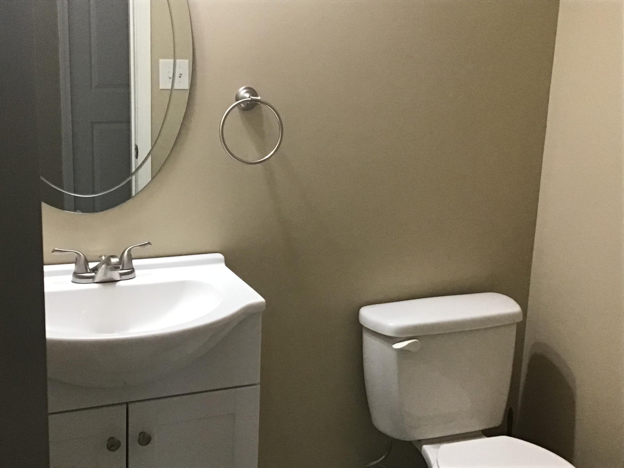 1604 Tilley Road Talbott, TN 37877 - Photo 17 of 31 a bathroom with a toilet sink and mirror