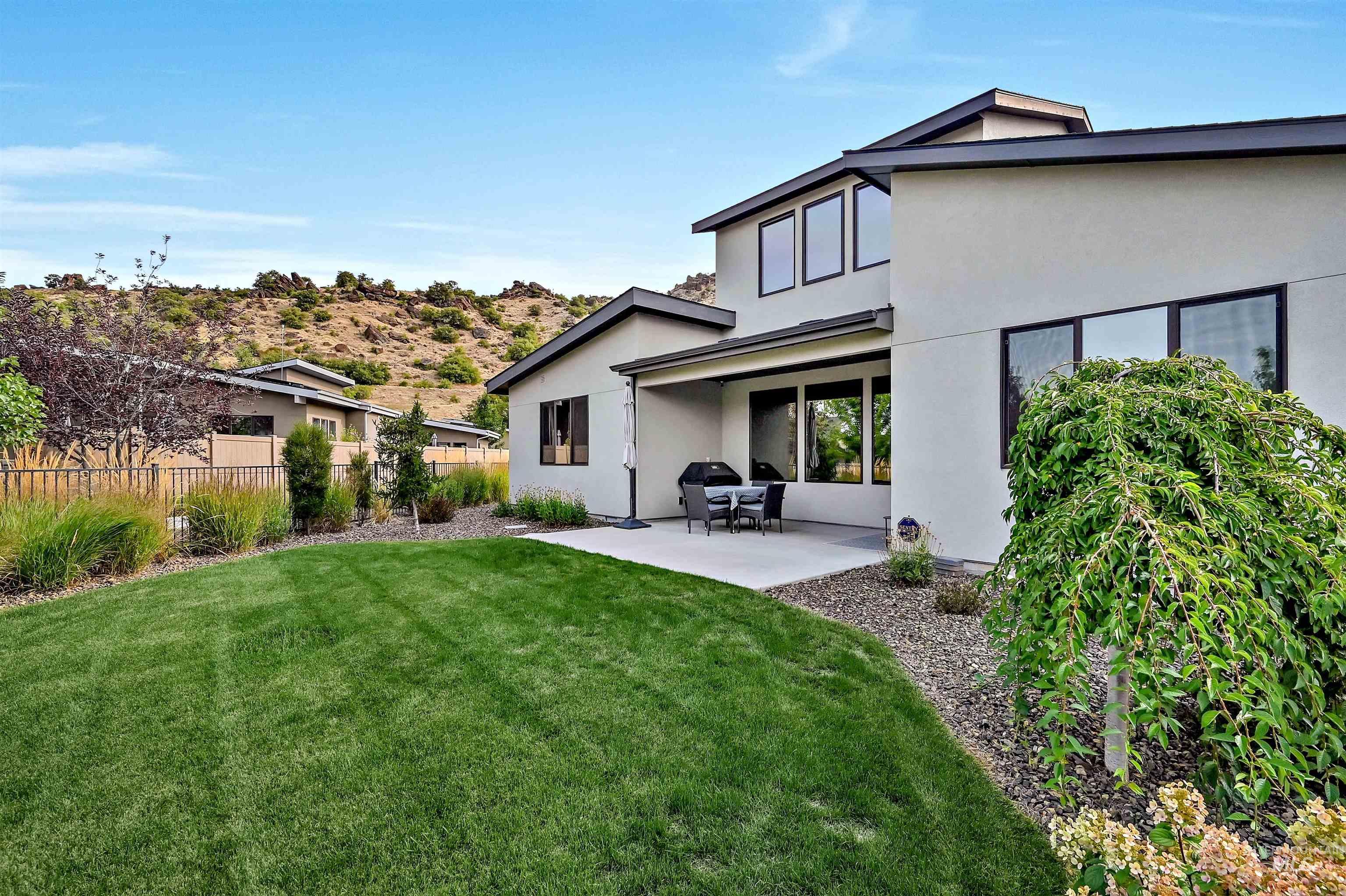1525 South Boulder View Lane Boise, ID 83712 - Photo 25 of 34 Back of house featuring a patio area and stucco siding