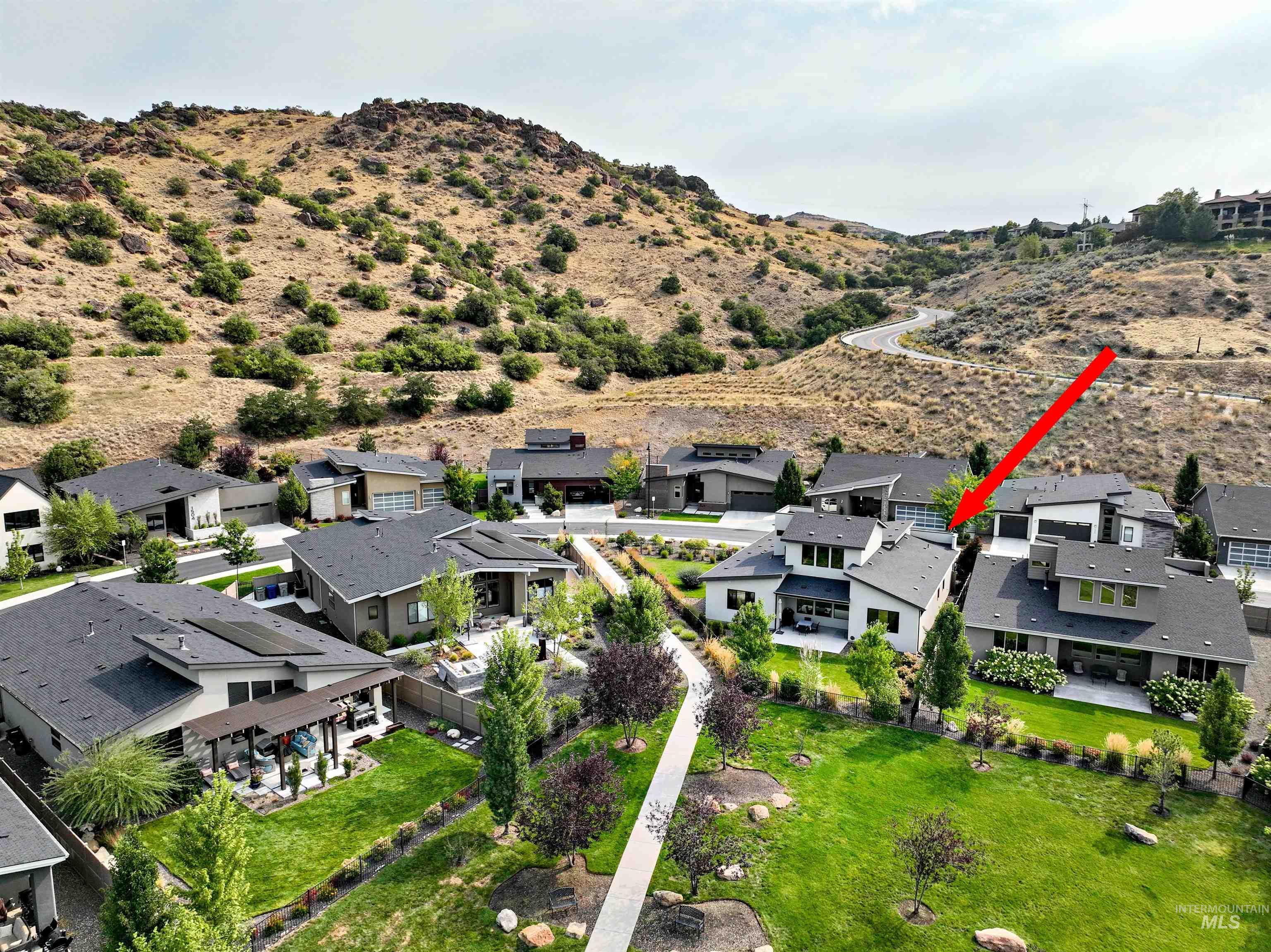 1525 South Boulder View Lane Boise, ID 83712 - Photo 3 of 34 Aerial perspective of suburban area with a mountain backdrop