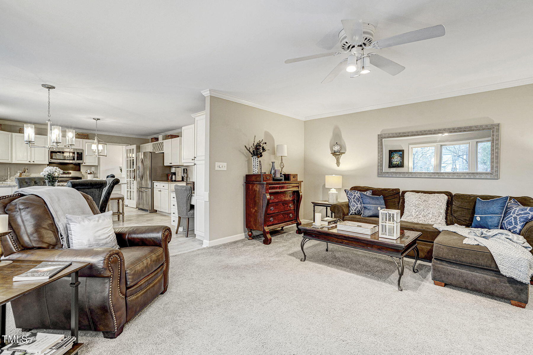 113 Waterfall Court Cary, NC 27513 - Photo 16 of 30 a living room with furniture and a chandelier