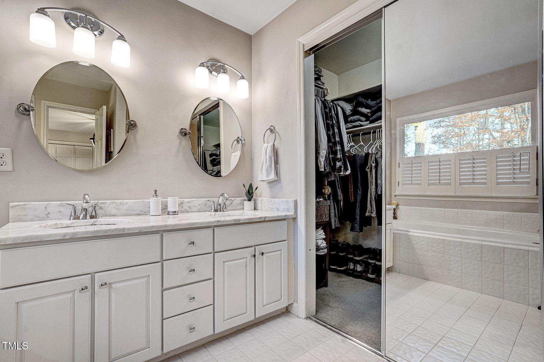 113 Waterfall Court Cary, NC 27513 - Photo 18 of 30 a bathroom with a double vanity sink and a mirror