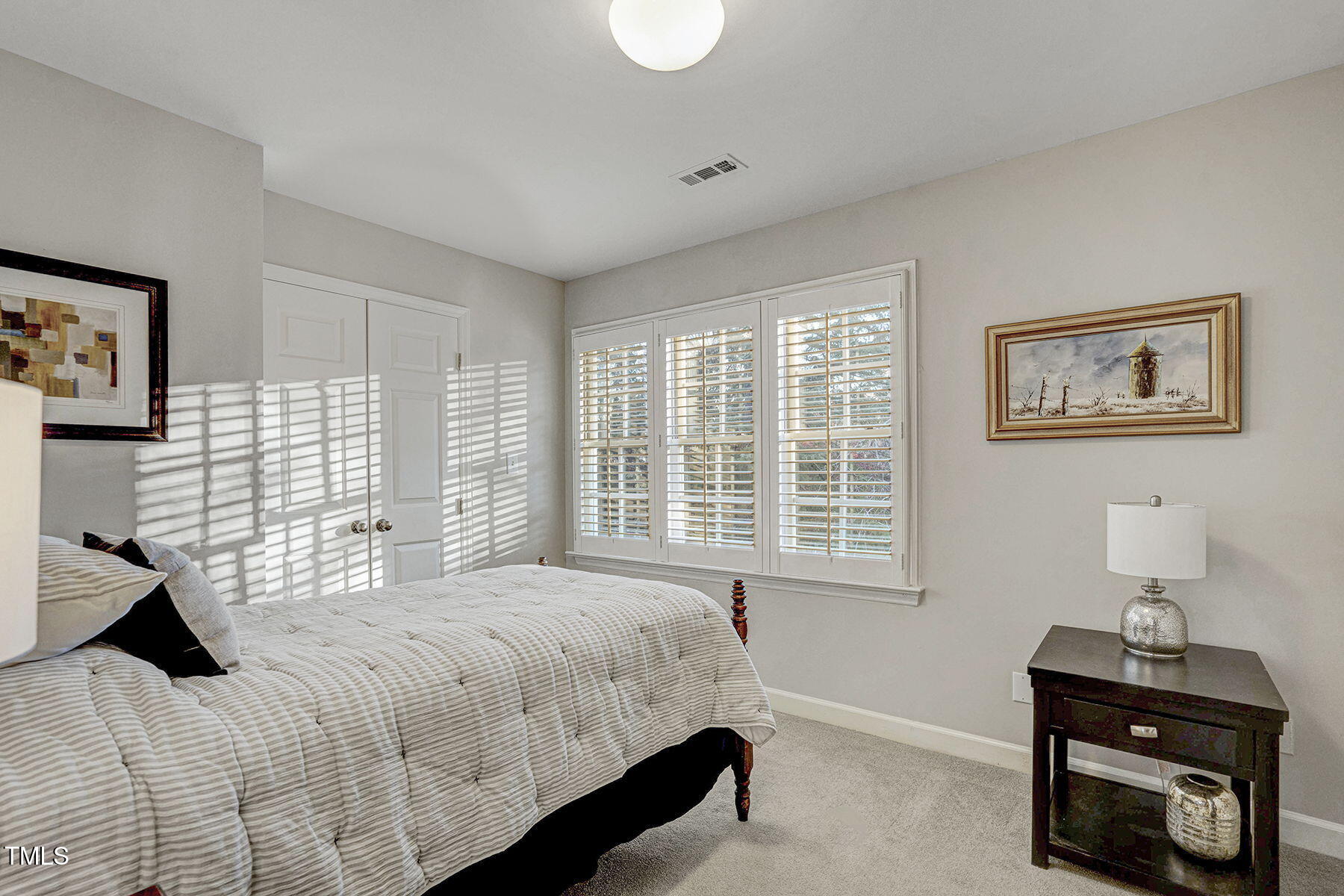 113 Waterfall Court Cary, NC 27513 - Photo 20 of 30 a bedroom with a bed and a window