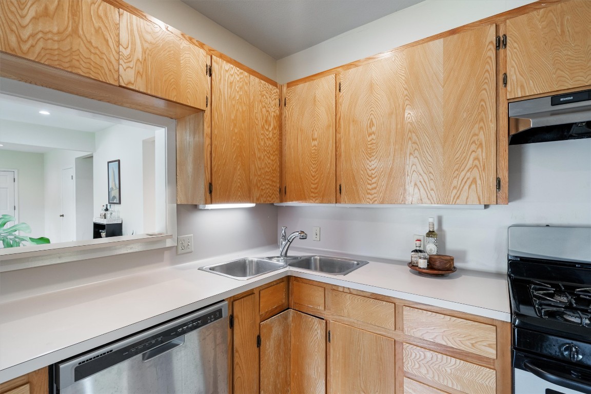 2116 Glendale Place Austin, TX 78704 - Photo 11 of 24 a kitchen with a sink cabinets and appliances