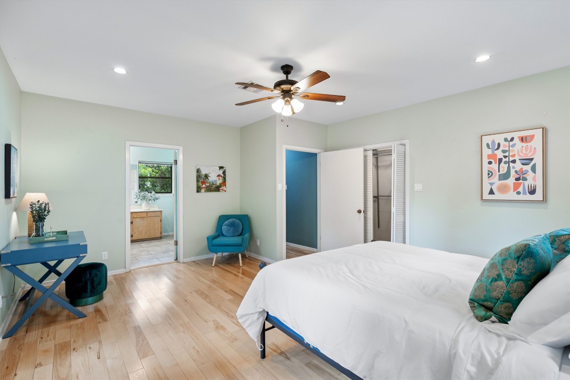 2116 Glendale Place Austin, TX 78704 - Photo 15 of 24 a bedroom with a bed and a chandelier