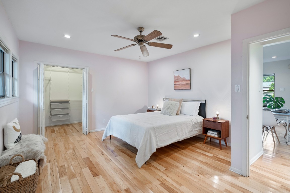 2116 Glendale Place Austin, TX 78704 - Photo 17 of 24 a bedroom with a bed and a chandelier