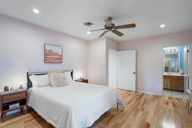 a bedroom with a bed and a dresser