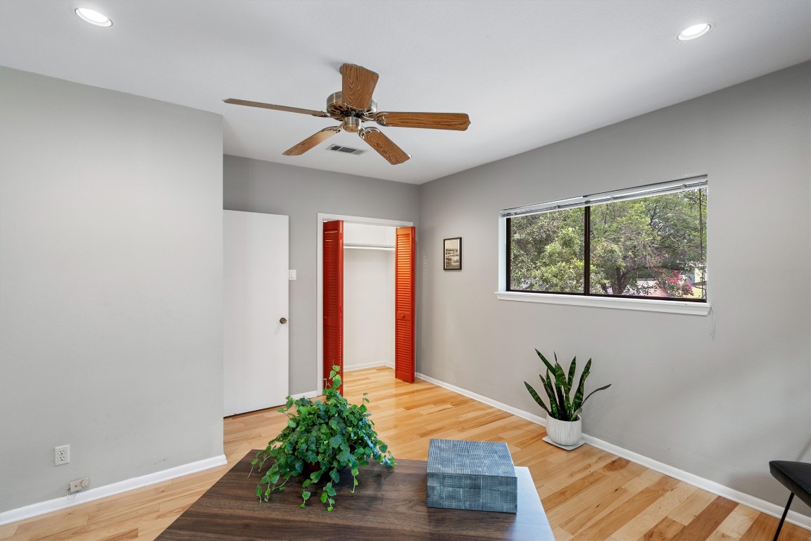 2116 Glendale Place Austin, TX 78704 - Photo 21 of 24 a very nice looking room with a ceiling fan and a window
