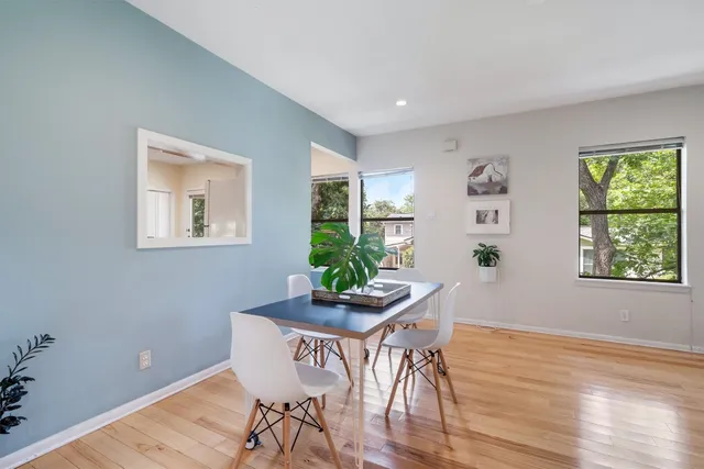 a view of a dining room with furniture window and wooden floor