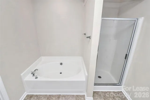 a bathroom with a white bath tub