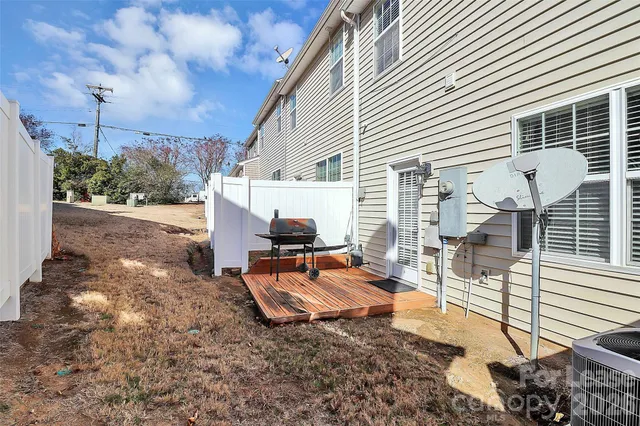 a backyard of a house with outdoor seating